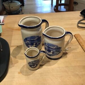 Vintage set of Pottery Pitchers.